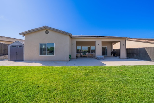 4631 Pleasant Hills Dr, Anderson, CA 96007 - back of property with fence, a patio area, a lawn, and a shed