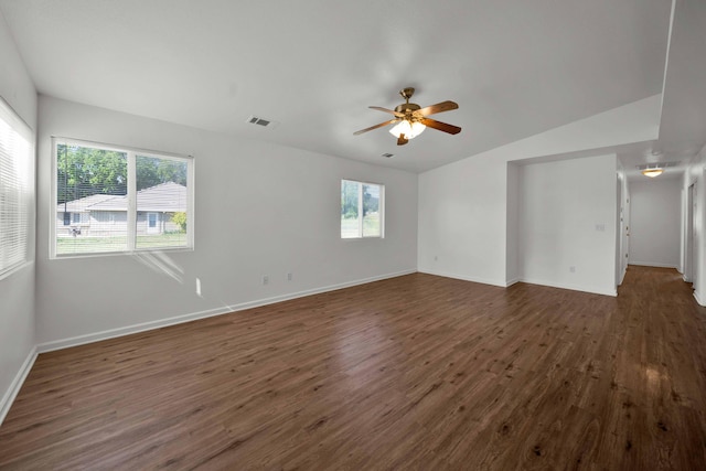 22496 Rio Alto Dr, Cottonwood, CA 96022 - empty room featuring dark wood-style flooring, ceiling fan, baseboards, and vaulted ceiling