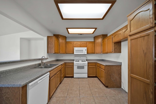 22496 Rio Alto Dr, Cottonwood, CA 96022 - kitchen featuring white appliances, a sink, brown cabinets, and light tile patterned floors