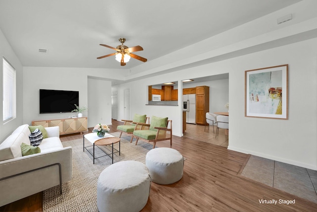 22496 Rio Alto Dr, Cottonwood, CA 96022 - living area with wood finished floors, ceiling fan, and baseboards