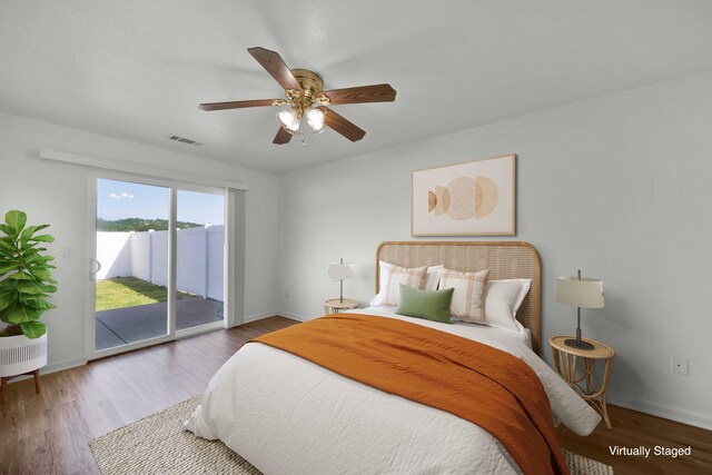 22496 Rio Alto Dr, Cottonwood, CA 96022 - bedroom featuring access to exterior, baseboards, wood finished floors, and a ceiling fan