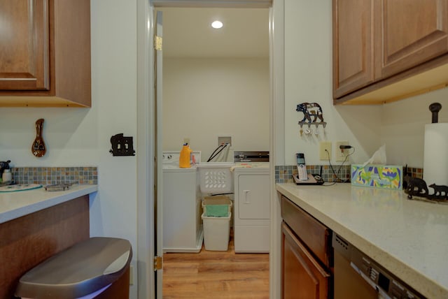 washroom with washer and dryer, laundry area, light wood finished floors, and recessed lighting