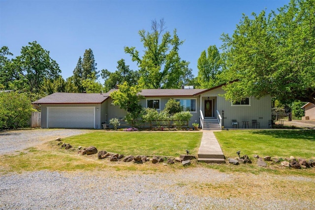 7090 Rio Rancho Rd, Anderson, CA 96007 - ranch-style house with driveway, a front yard, and a garage