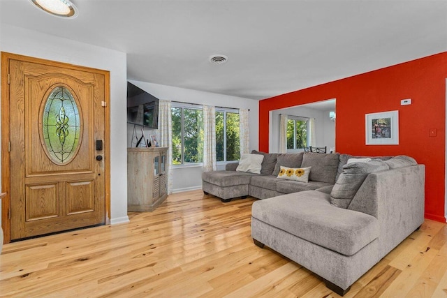 7090 Rio Rancho Rd, Anderson, CA 96007 - living room featuring baseboards, wood finished floors, and visible vents