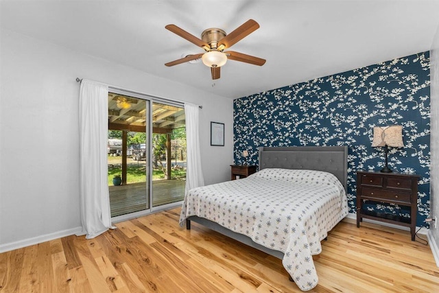 7090 Rio Rancho Rd, Anderson, CA 96007 - bedroom featuring wallpapered walls, baseboards, wood finished floors, and access to outside