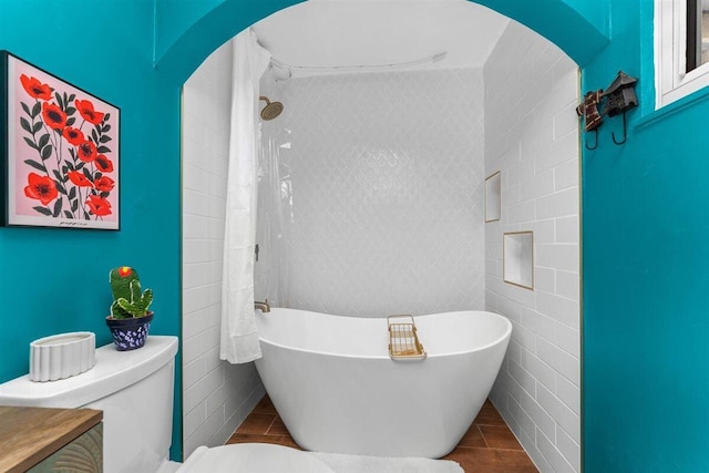 7090 Rio Rancho Rd, Anderson, CA 96007 - bathroom with a freestanding bath, tile walls, toilet, and a shower
