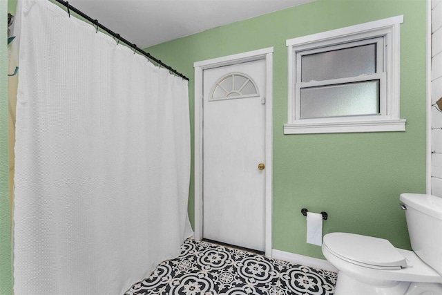 7090 Rio Rancho Rd, Anderson, CA 96007 - bathroom featuring baseboards and toilet