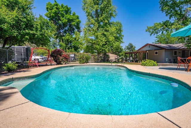 7090 Rio Rancho Rd, Anderson, CA 96007 - view of swimming pool featuring fence, a patio, and a fenced in pool