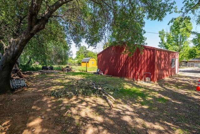 7090 Rio Rancho Rd, Anderson, CA 96007 - view of yard featuring fence and an outbuilding