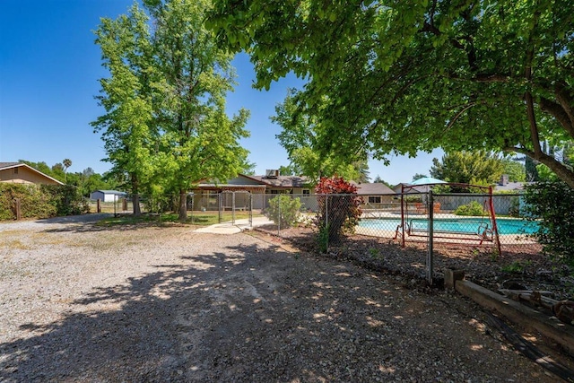 7090 Rio Rancho Rd, Anderson, CA 96007 - view of yard featuring a fenced in pool and fence