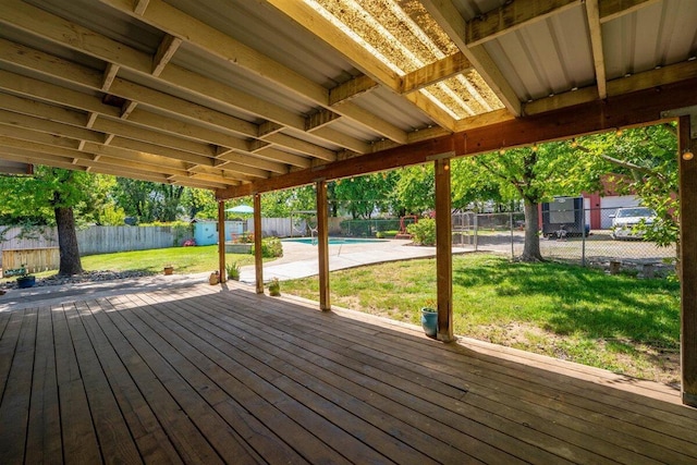 7090 Rio Rancho Rd, Anderson, CA 96007 - deck featuring a fenced backyard, an outbuilding, a yard, a fenced in pool, and a storage unit