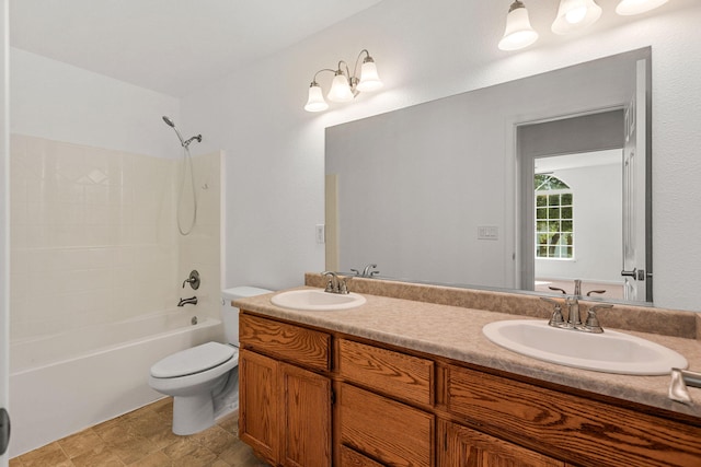 full bathroom featuring toilet, a sink, double vanity, and shower / bathing tub combination