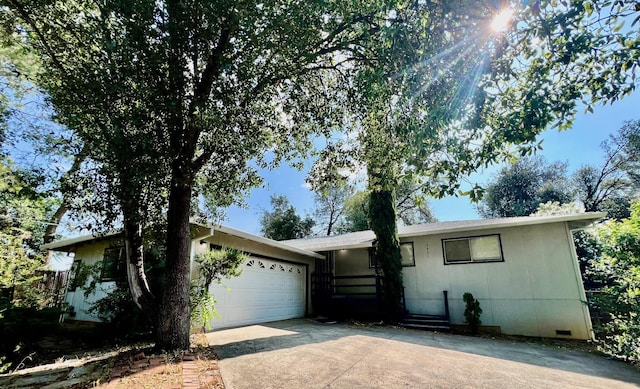 3901 El Portal Dr, Redding, CA 96002 - ranch-style house featuring concrete driveway, an attached garage, and crawl space