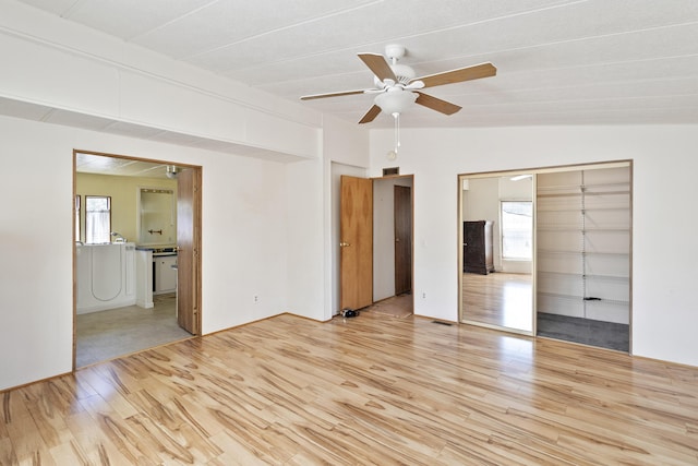 unfurnished bedroom featuring wood finished floors and ceiling fan