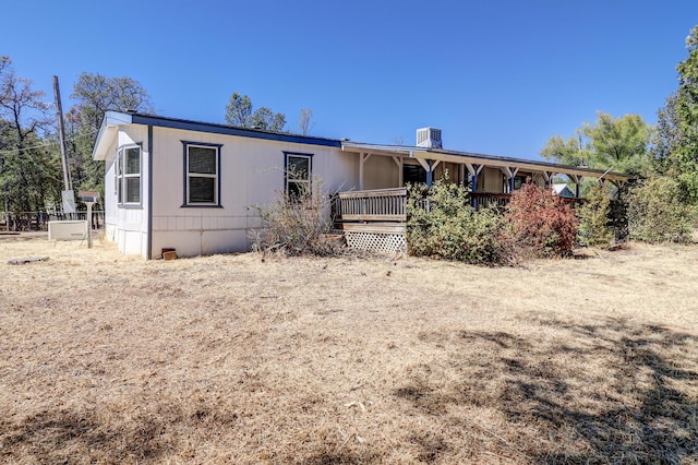 manufactured / mobile home featuring a porch and cooling unit