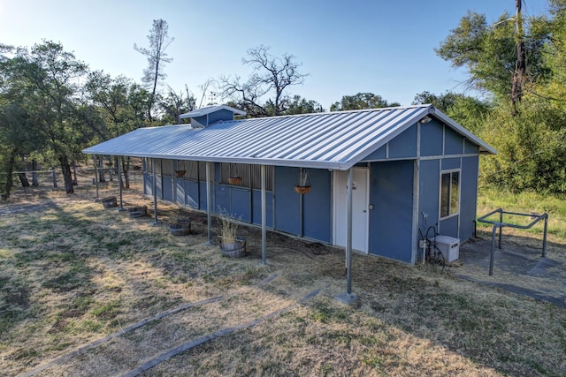 view of outdoor structure featuring fence