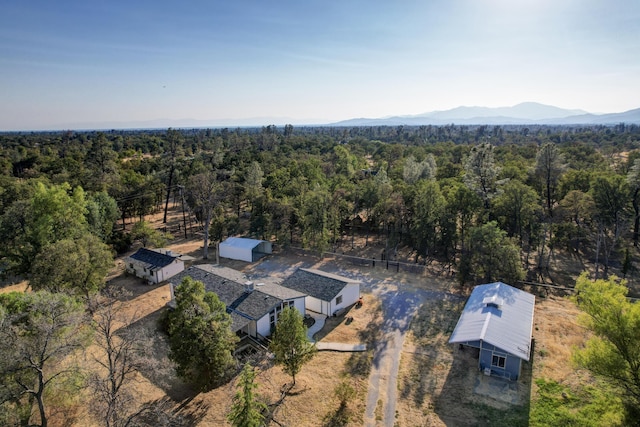 bird's eye view with a view of trees and a mountain view