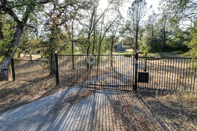view of gate featuring fence