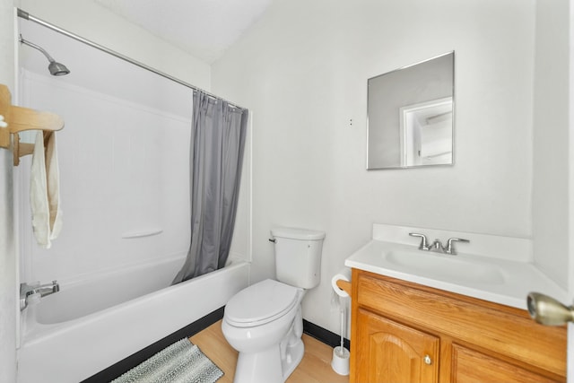 full bathroom featuring toilet, vanity, wood finished floors, and shower / bathtub combination with curtain