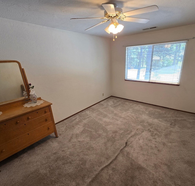 37150 Sapphire Rd, Burney, CA 96013 - spare room with a ceiling fan and carpet