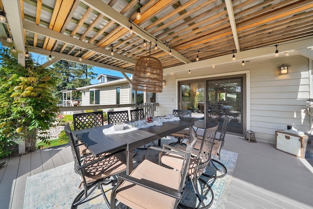 wooden terrace featuring outdoor dining area