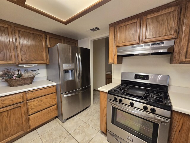 3671 Santa Rosa Way, Redding, CA 96003 - kitchen featuring visible vents, stainless steel appliances, under cabinet range hood, and light tile patterned flooring