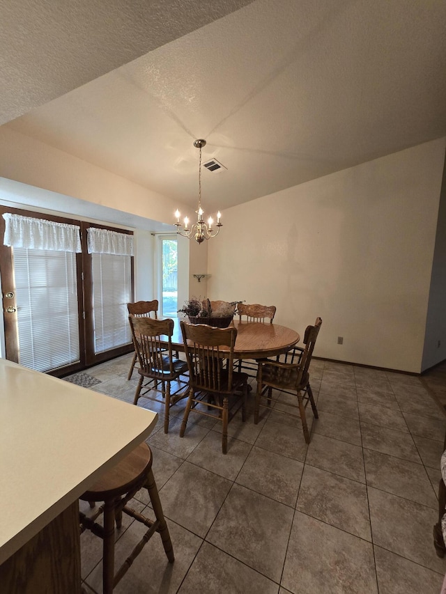 3671 Santa Rosa Way, Redding, CA 96003 - dining room featuring visible vents, tile patterned flooring, and a notable chandelier