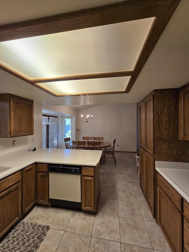 3671 Santa Rosa Way, Redding, CA 96003 - kitchen featuring light tile patterned flooring, dishwasher, an inviting chandelier, light countertops, and a peninsula