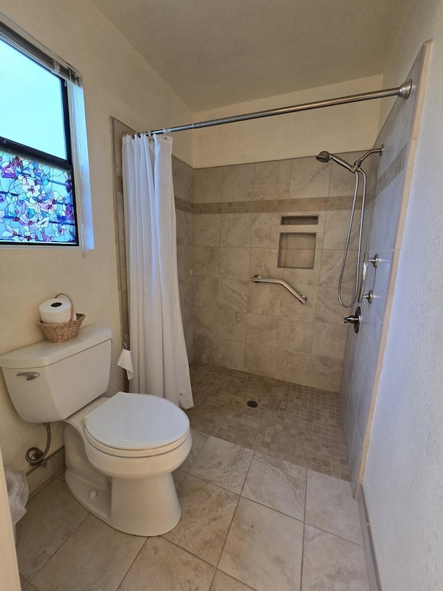 3671 Santa Rosa Way, Redding, CA 96003 - full bathroom featuring tile patterned flooring, toilet, and tiled shower