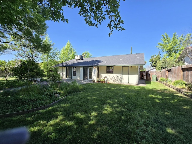 3671 Santa Rosa Way, Redding, CA 96003 - rear view of property with a lawn and a fenced backyard