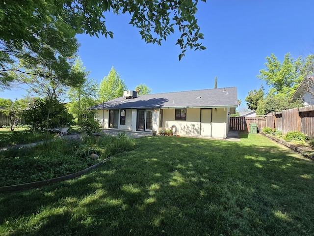 3671 Santa Rosa Way, Redding, CA 96003 - back of house featuring a lawn and a fenced backyard
