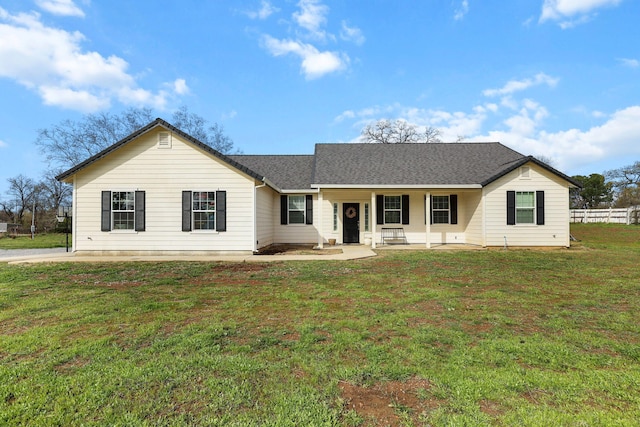 22070 Lassen View Dr, Palo Cedro, CA 96073 - ranch-style home with roof with shingles, a porch, and a front yard