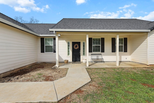 22070 Lassen View Dr, Palo Cedro, CA 96073 - view of exterior entry featuring a porch and a shingled roof
