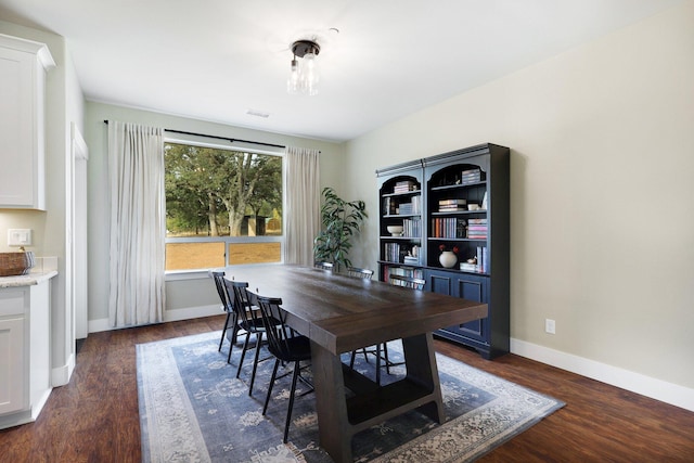 22070 Lassen View Dr, Palo Cedro, CA 96073 - dining space with visible vents, baseboards, and dark wood-style flooring