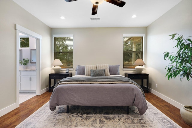 22070 Lassen View Dr, Palo Cedro, CA 96073 - bedroom with connected bathroom, baseboards, dark wood-type flooring, visible vents, and recessed lighting