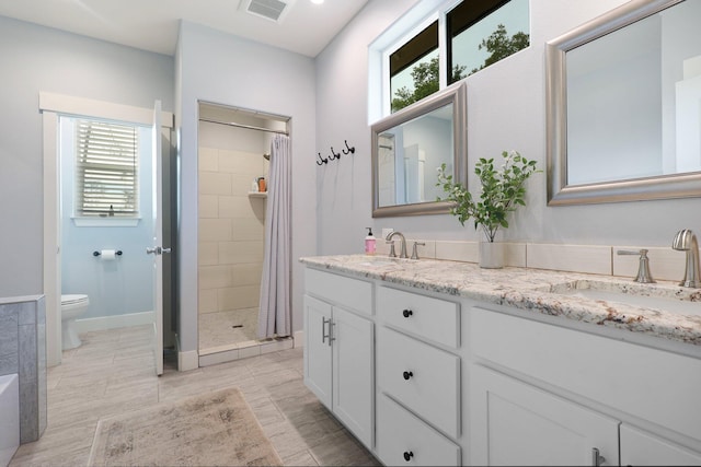 22070 Lassen View Dr, Palo Cedro, CA 96073 - bathroom featuring plenty of natural light, visible vents, a sink, and toilet