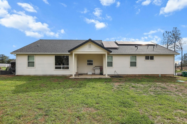 22070 Lassen View Dr, Palo Cedro, CA 96073 - rear view of property with roof mounted solar panels, a patio area, a lawn, and roof with shingles