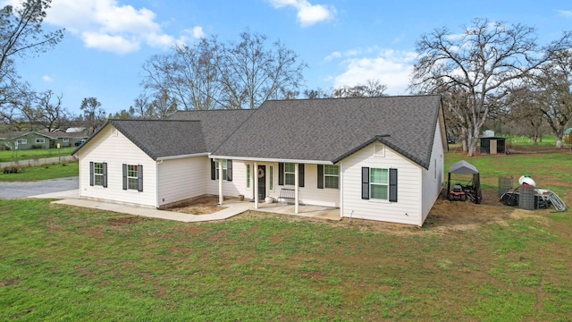 22070 Lassen View Dr, Palo Cedro, CA 96073 - view of front of property featuring covered porch, a front lawn, and roof with shingles