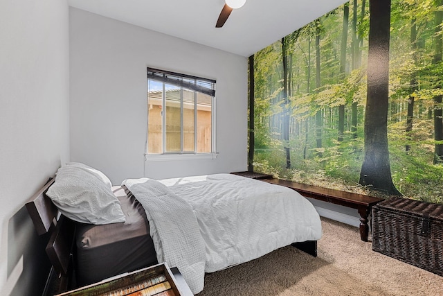 carpeted bedroom featuring a ceiling fan