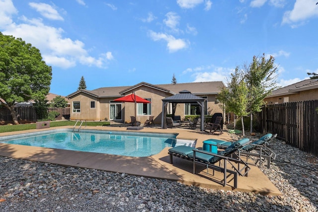 view of pool with a patio, a gazebo, a fenced in pool, and a fenced backyard