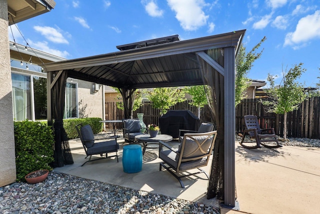 view of patio / terrace featuring a gazebo and fence