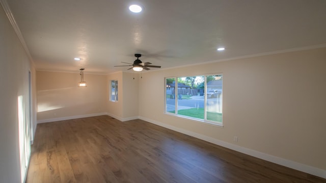 spare room with baseboards, recessed lighting, a ceiling fan, wood finished floors, and crown molding