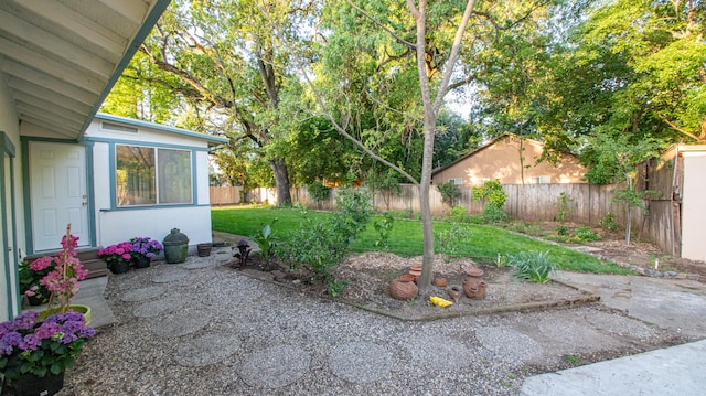 view of yard with a fenced backyard and a patio area