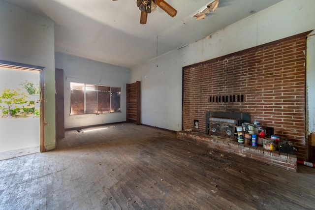 1868 Gold St, Redding, CA 96001 - unfurnished living room featuring a ceiling fan, wood-type flooring, and a brick fireplace