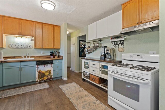 19715 Reed Rd, Cottonwood, CA 96022 - kitchen featuring gas range gas stove, dishwasher, under cabinet range hood, a sink, and dark wood-style floors