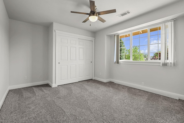 20340 Greenview Dr, Redding, CA 96002 - unfurnished bedroom featuring baseboards, carpet flooring, a closet, and a ceiling fan