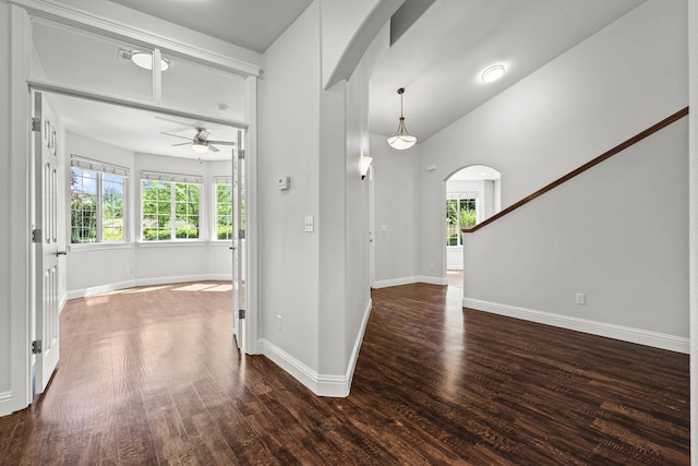 20340 Greenview Dr, Redding, CA 96002 - entryway featuring arched walkways, ceiling fan, wood finished floors, and baseboards