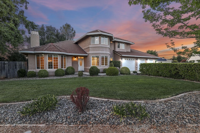 20340 Greenview Dr, Redding, CA 96002 - view of front of house featuring a chimney, stucco siding, a tiled roof, and driveway