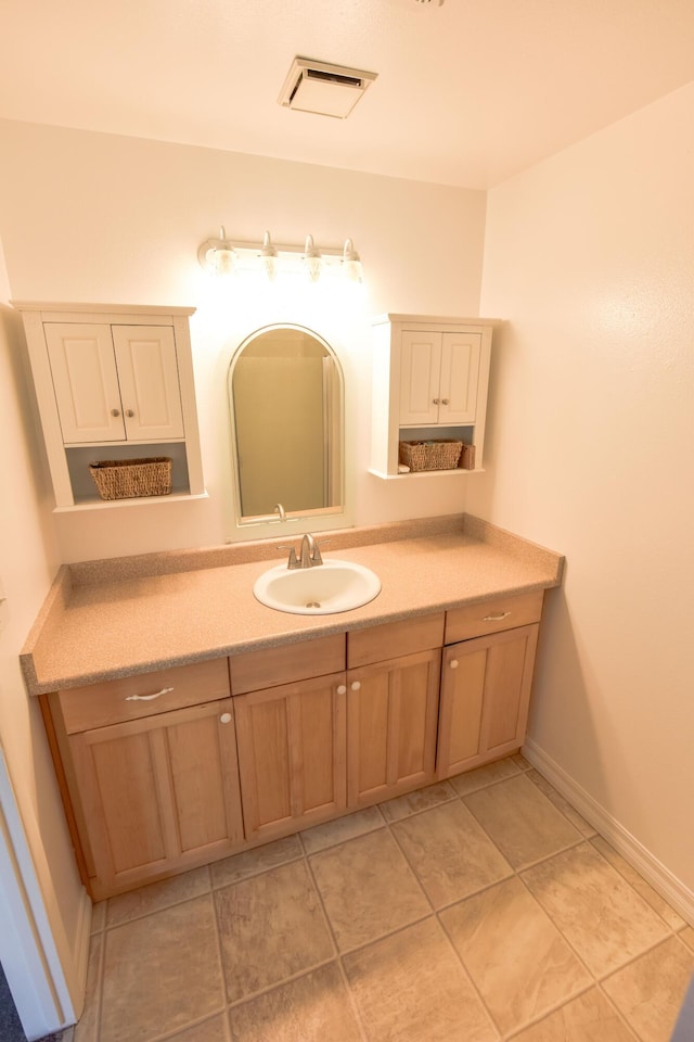 bathroom featuring vanity and visible vents