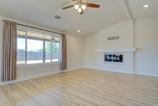 3503 Americana Way, Redding, CA 96003 - unfurnished living room with a glass covered fireplace, wood finished floors, vaulted ceiling with beams, and a ceiling fan